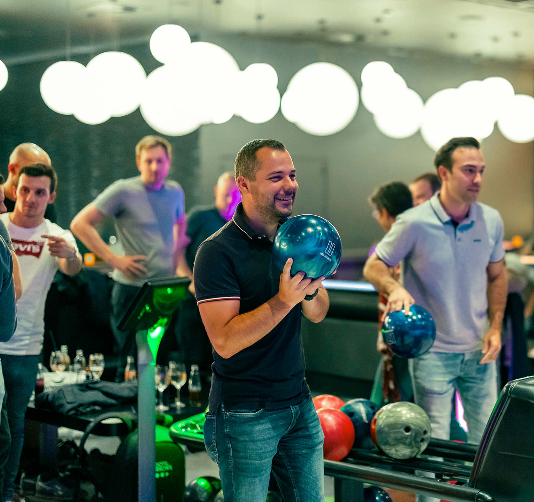 The Dots & Arrows team bowling at a quarterly team event